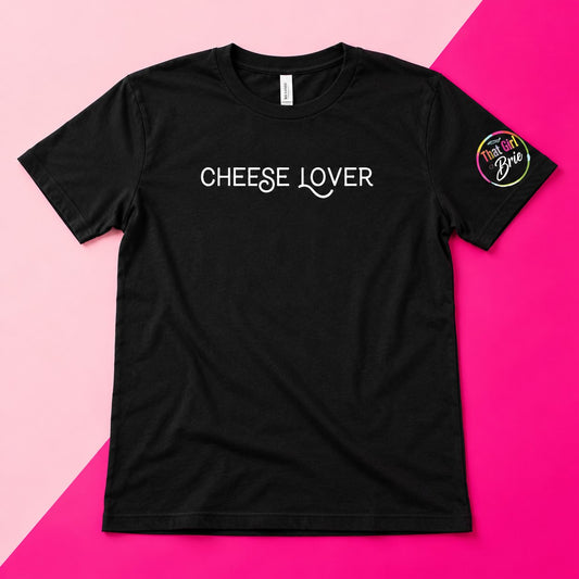 Black Cheese Lover t-shirt with That Girl Brie sleeve logo on a pink background