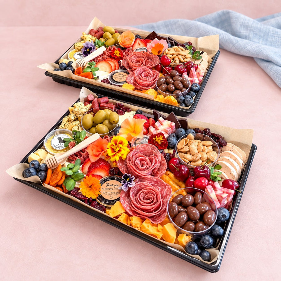 Two Gather Board charcuterie platters ready for a small gathering, with a blue linen napkin