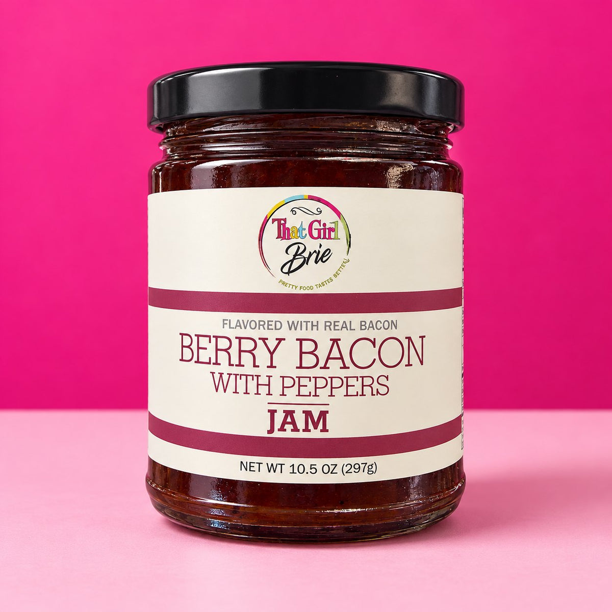 Berry Bacon with Peppers jam jar on a hot pink background