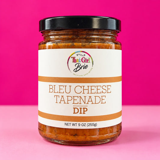 Bleu cheese tapenade blue cheese spread in a jar on a hot pink background