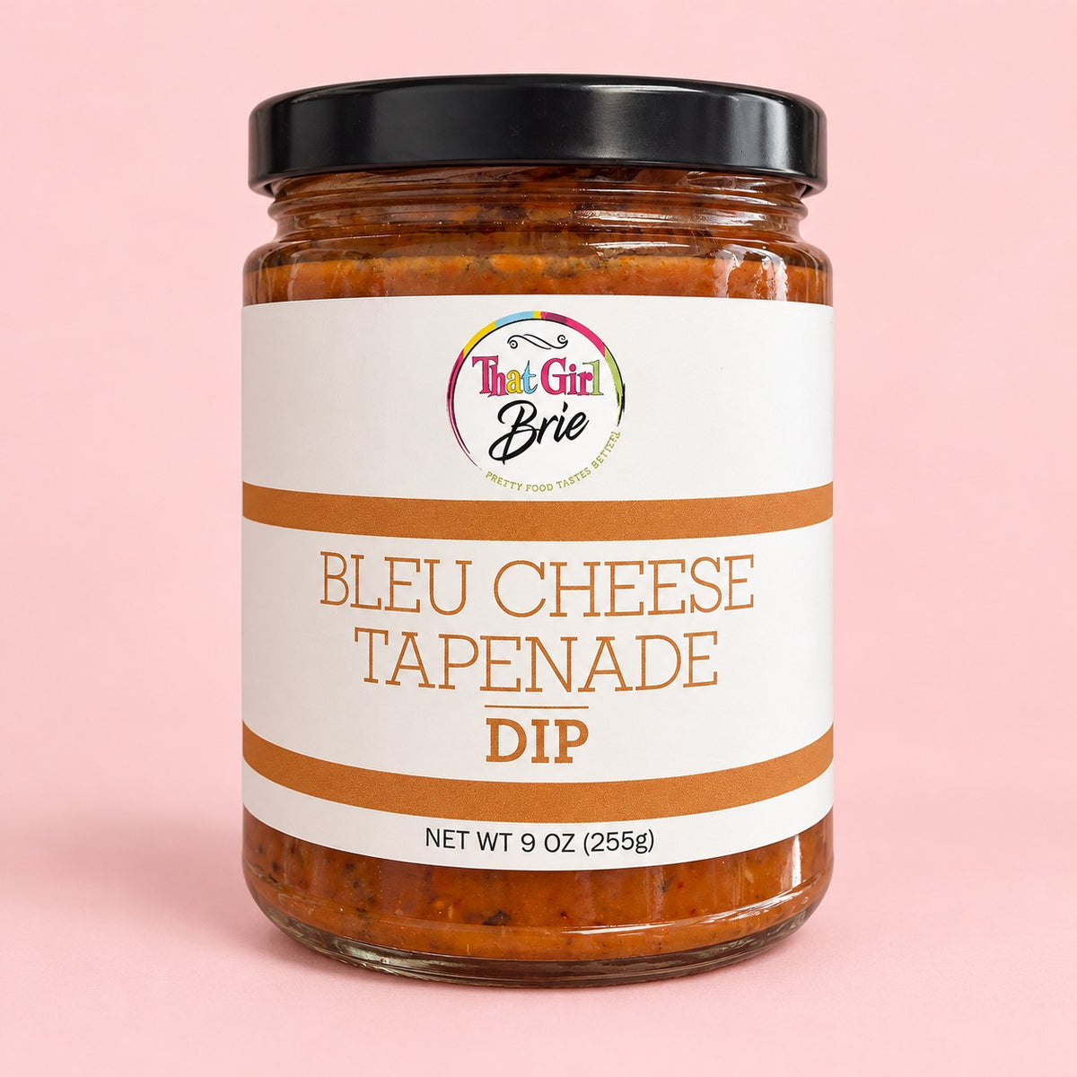 Jar of Bleu Cheese Tapenade blue cheese dip on a light pink background