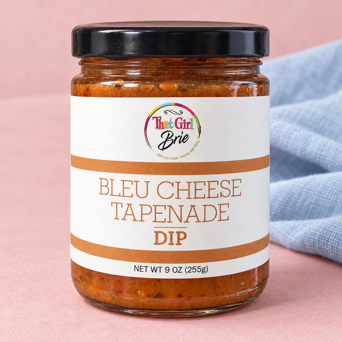 That Girl Brie Bleu Cheese Tapenade Dip jar with a blue linen napkin