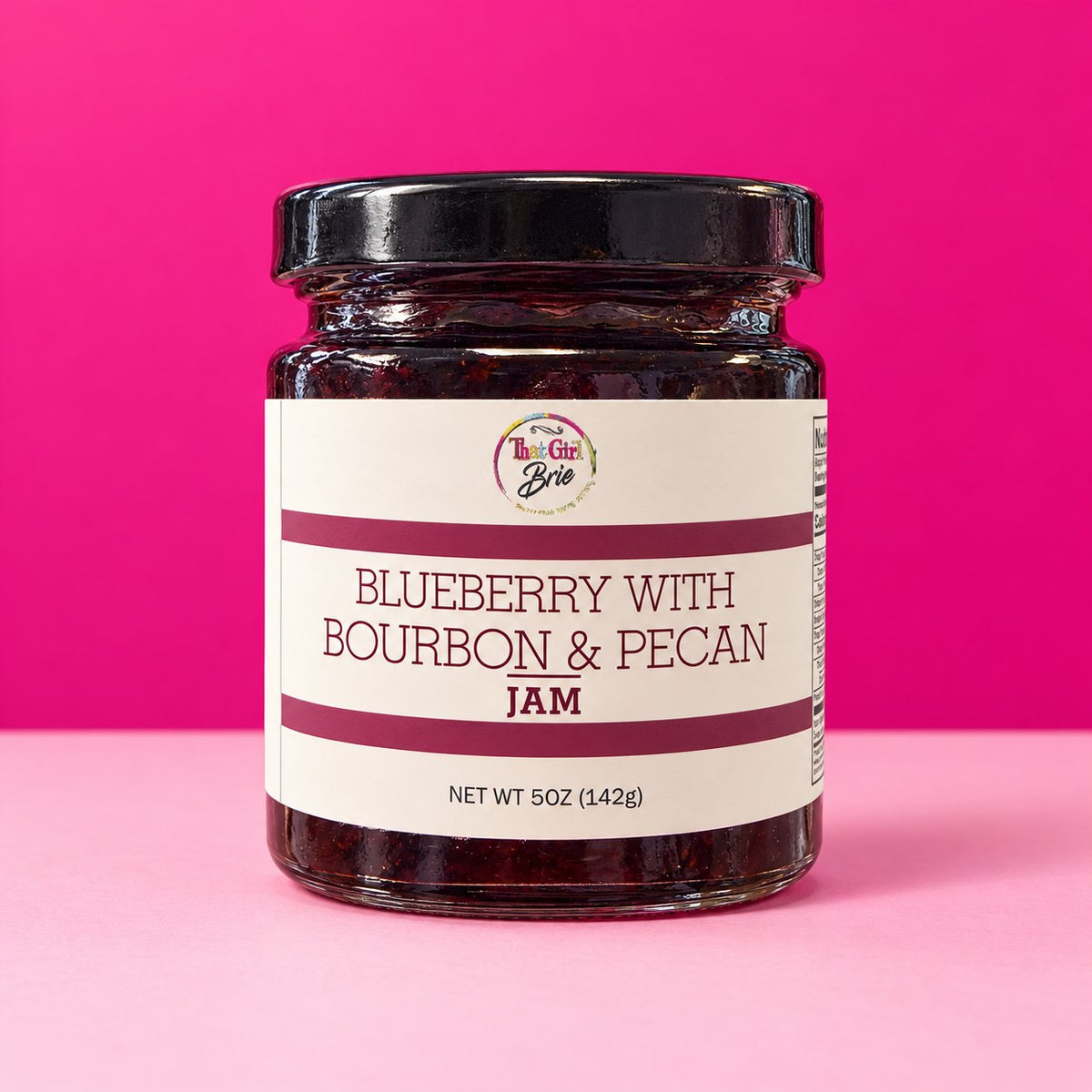 5 oz Blueberry with Bourbon & Pecan jam jar on a hot pink background