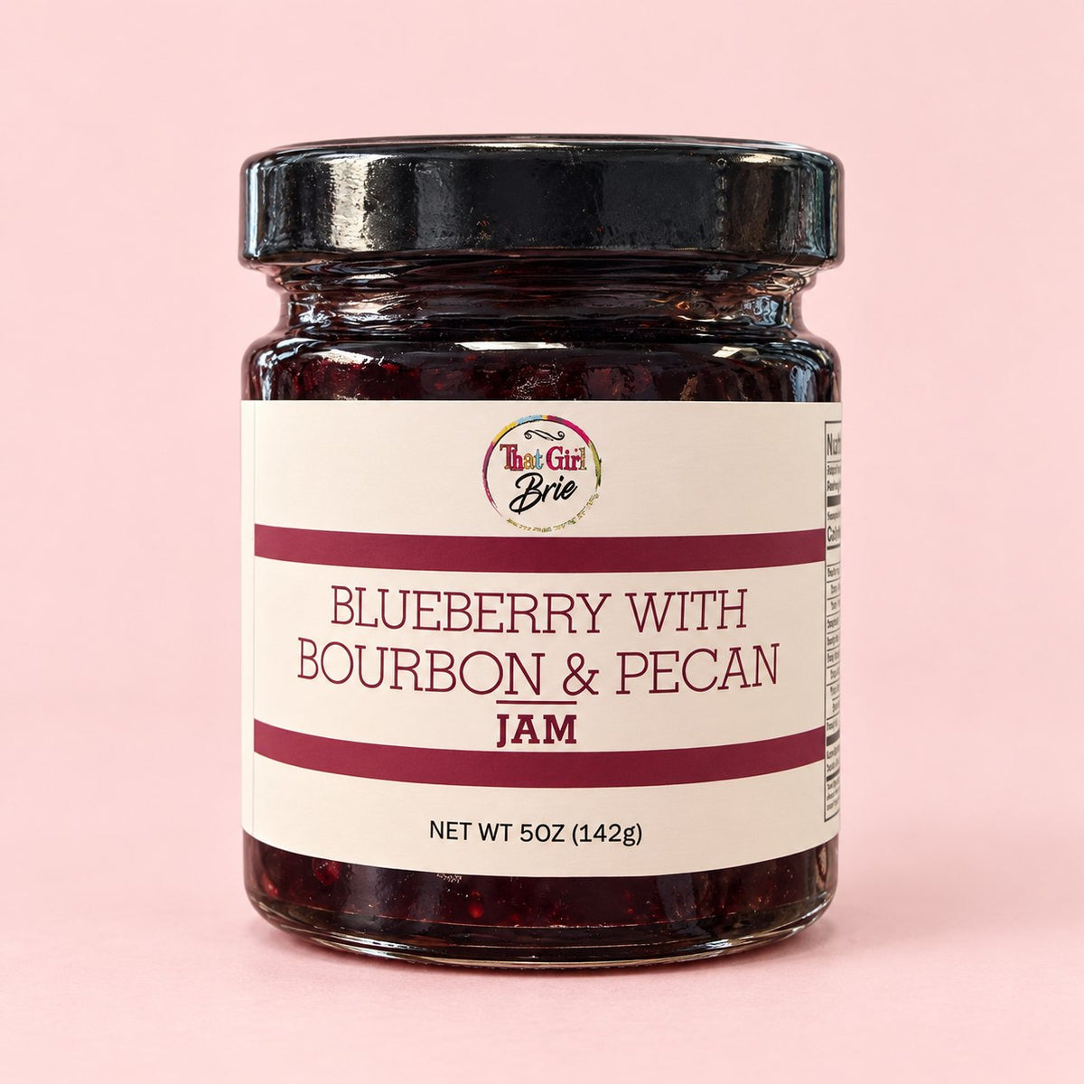 Small 5 oz jar of Blueberry with Bourbon & Pecan blueberry bourbon jam on a light pink background