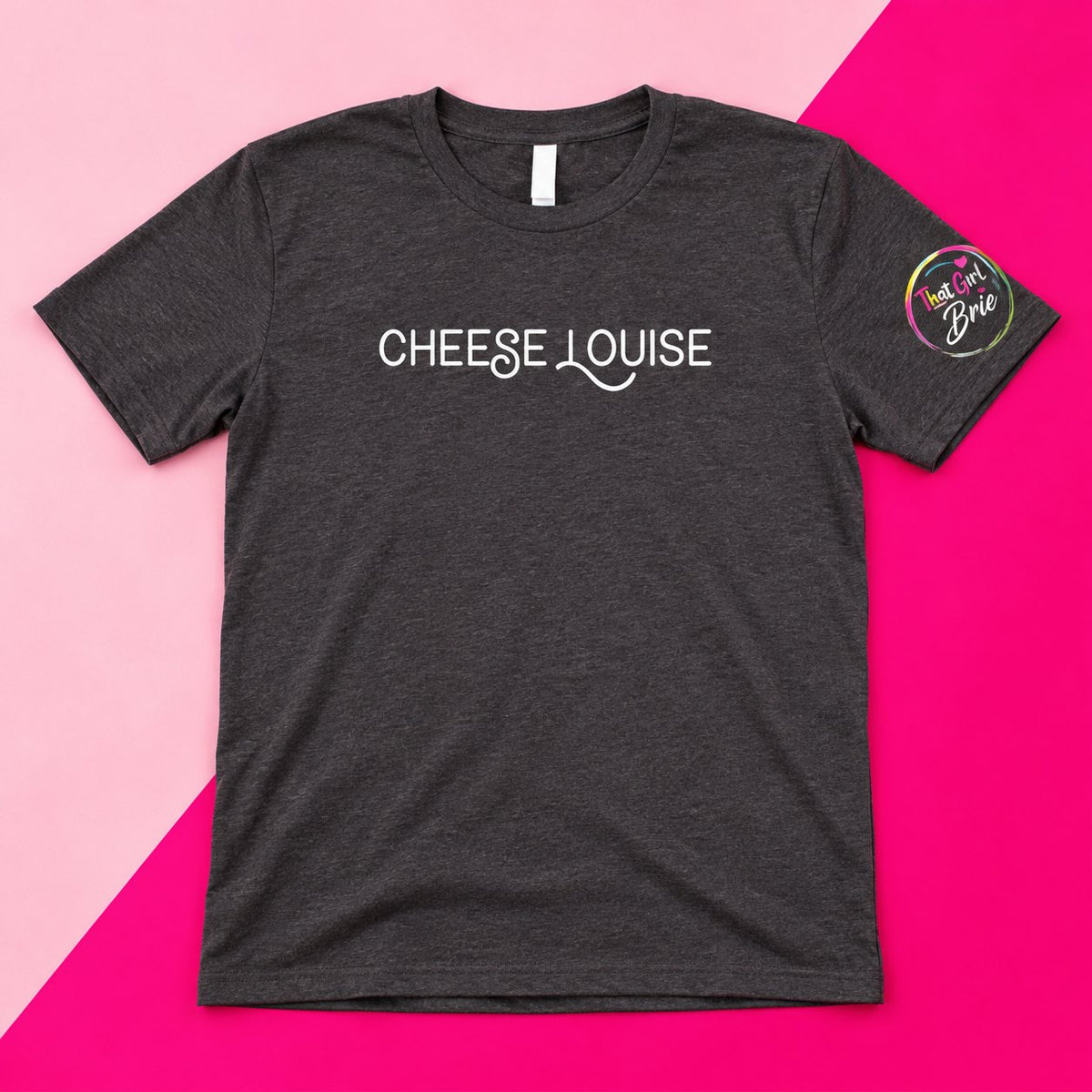 Cheese Louise t-shirt in heather charcoal with That Girl Brie sleeve logo on a pink background