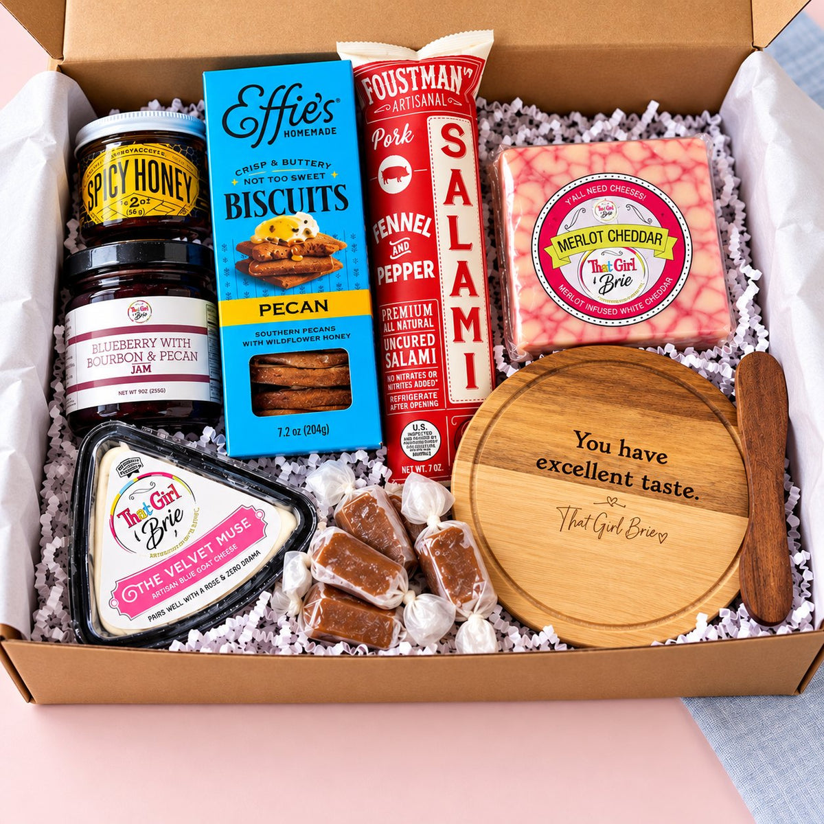 The Excellent Taste Box cheese board gift set with Effie's Biscuits, Wisconsin caramels and a You have excellent taste board