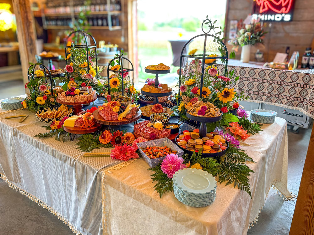 Sunflowers and macarons: grazing table by That Girl Brie