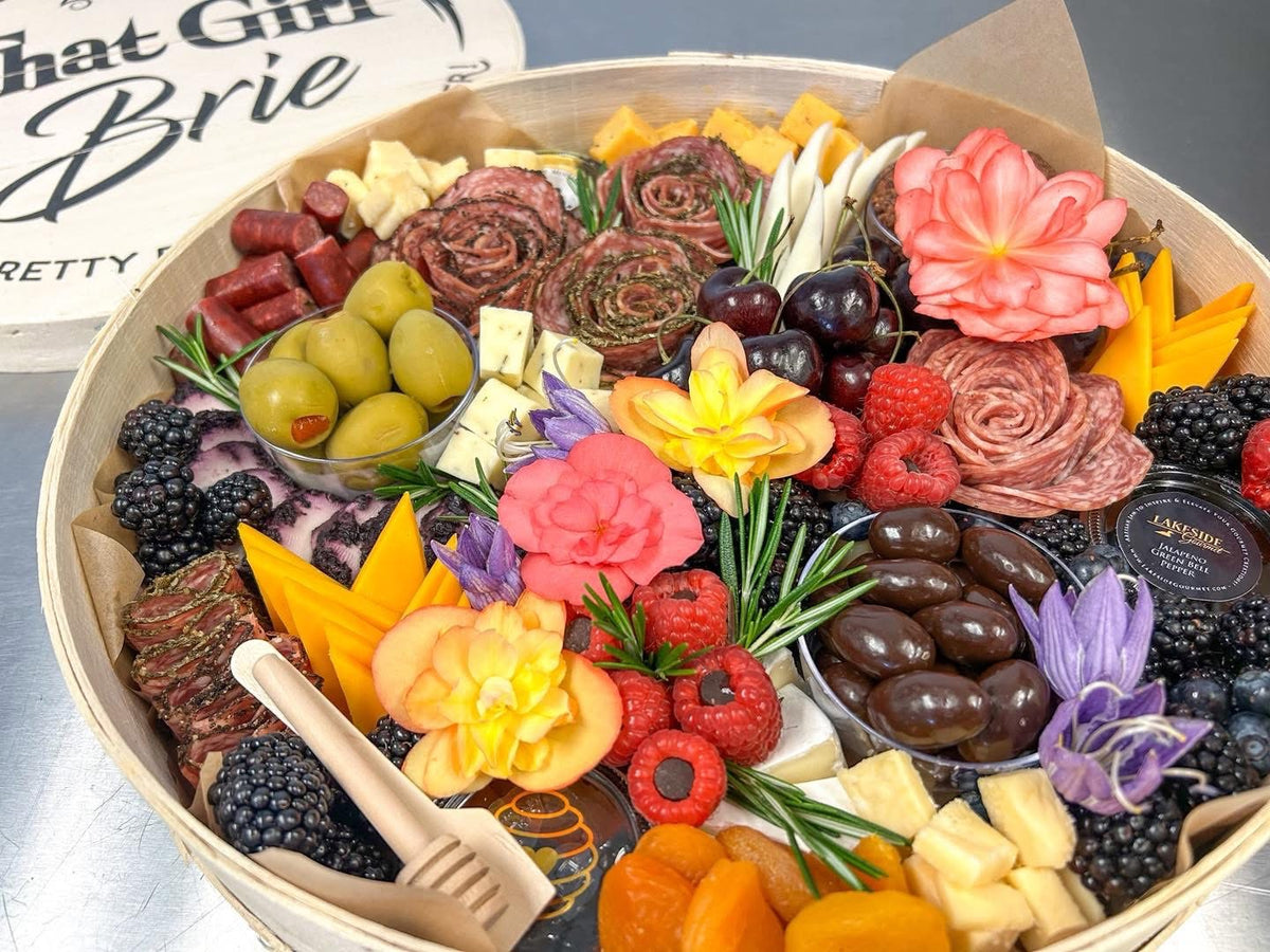 The Grand Gift Keepsake 15 inch charcuterie board with salami roses, Wisconsin cheese, berries and edible flowers in a That Girl Brie wooden box