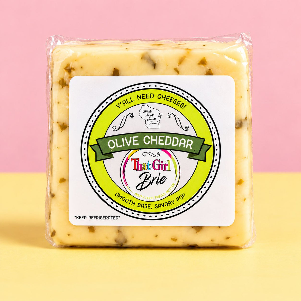 Olive Cheddar, cheddar with olives, in That Girl Brie packaging