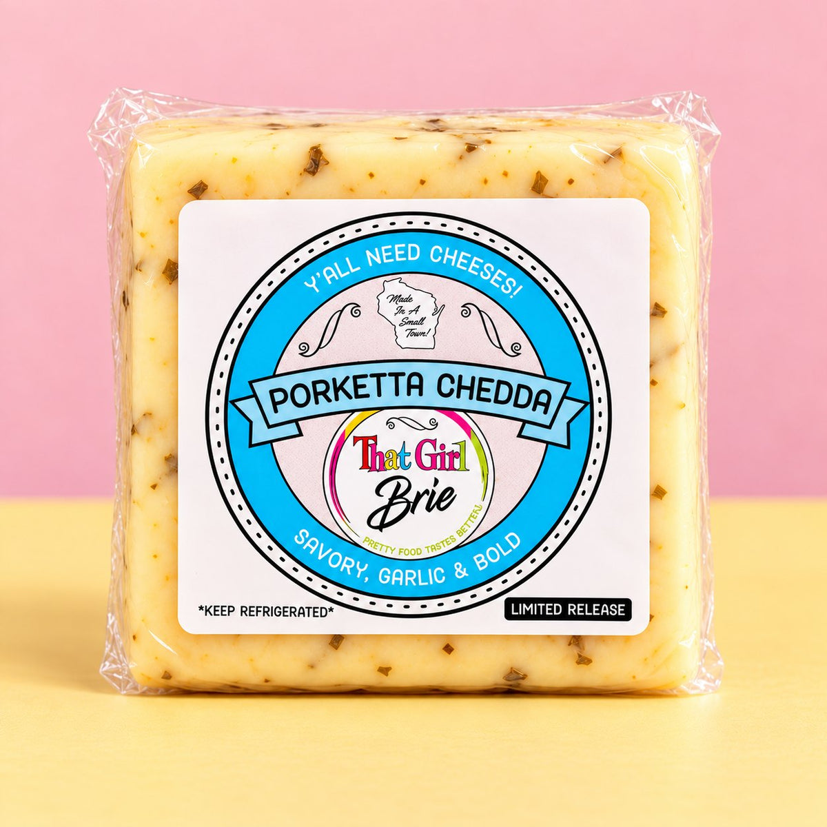 Porketta Chedda garlic cheddar cheese in That Girl Brie packaging