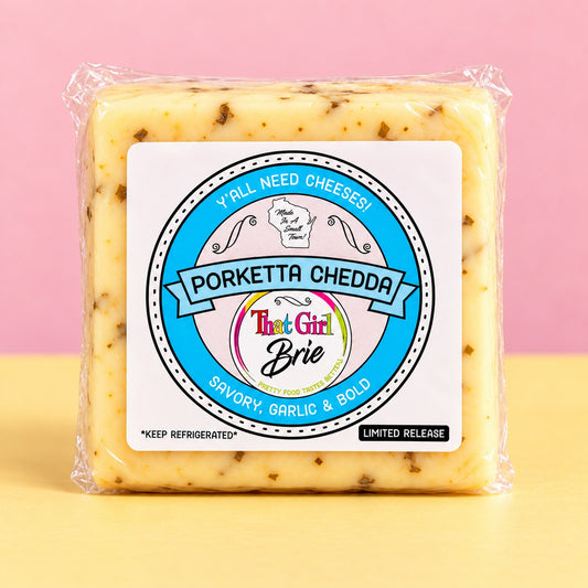 Porketta Chedda garlic cheddar cheese in That Girl Brie packaging