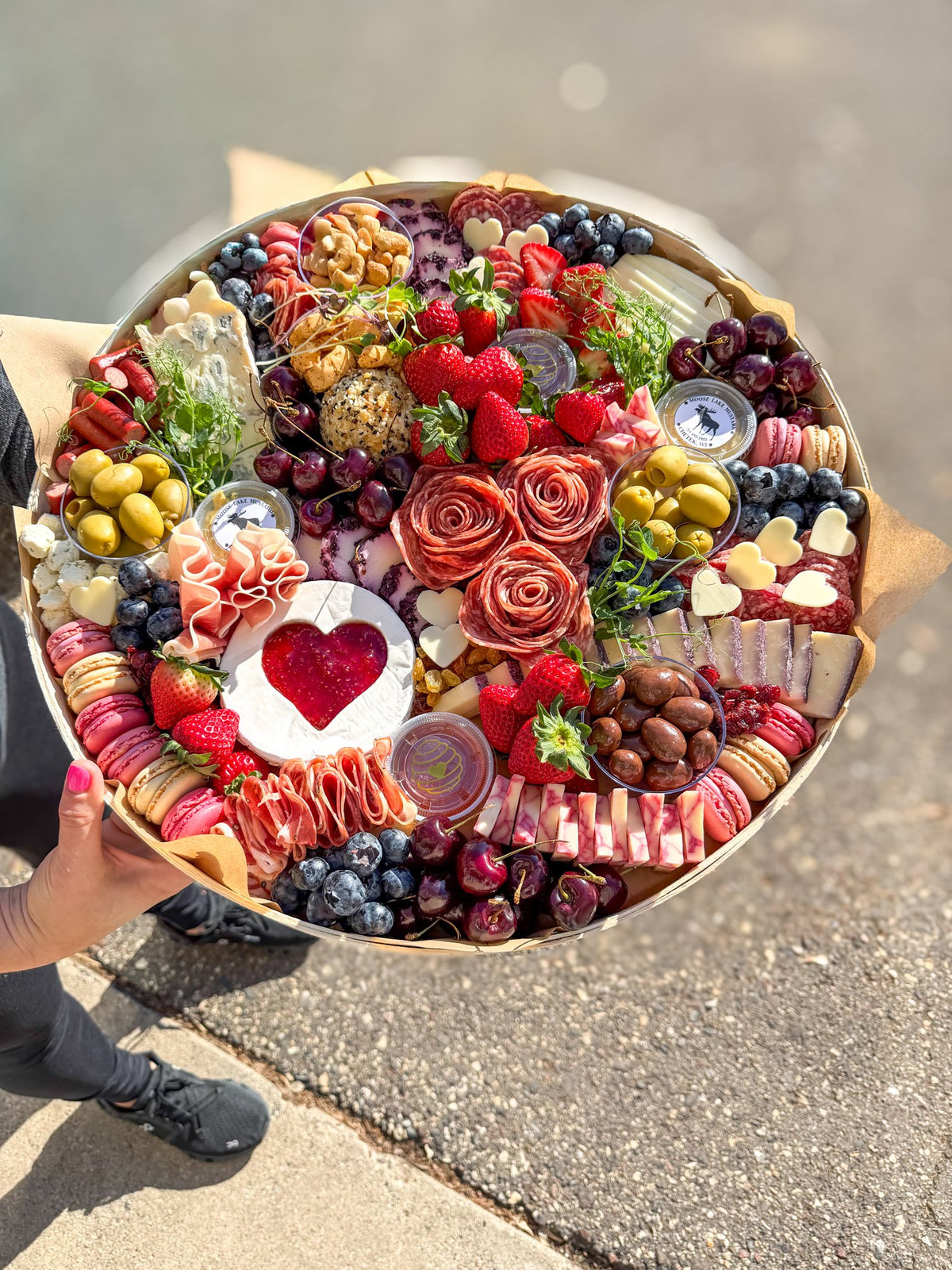 The Shindig large charcuterie board with salami roses, a heart brie, strawberries and macarons