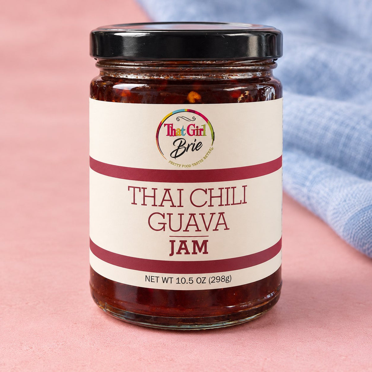 Thai Chili Guava sweet Thai chili jam jar with a blue linen napkin