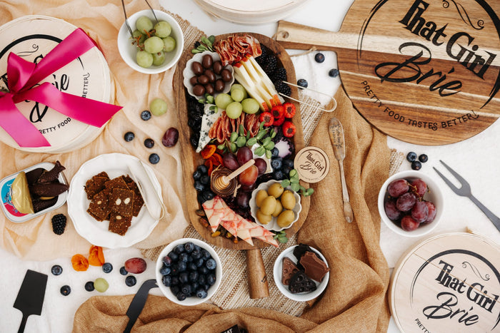 Charcuterie spread styled with fresh flowers