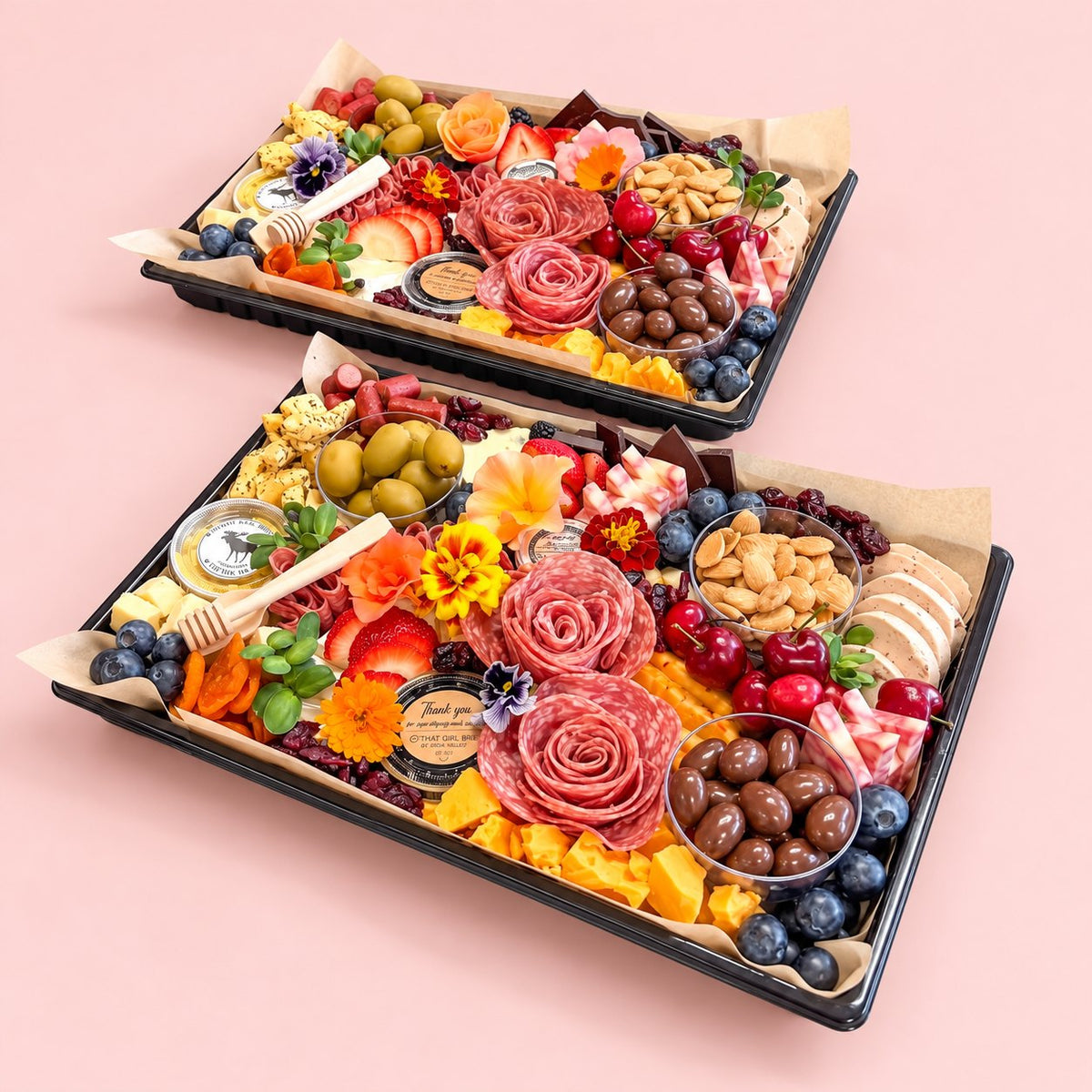 Two Gather Board charcuterie platters with salami roses, fresh berries, cheeses and chocolate almonds