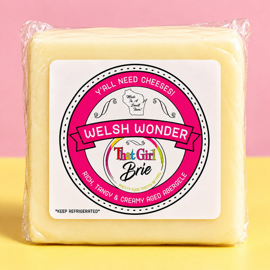 Welsh Wonder aged Welsh cheddar in That Girl Brie packaging