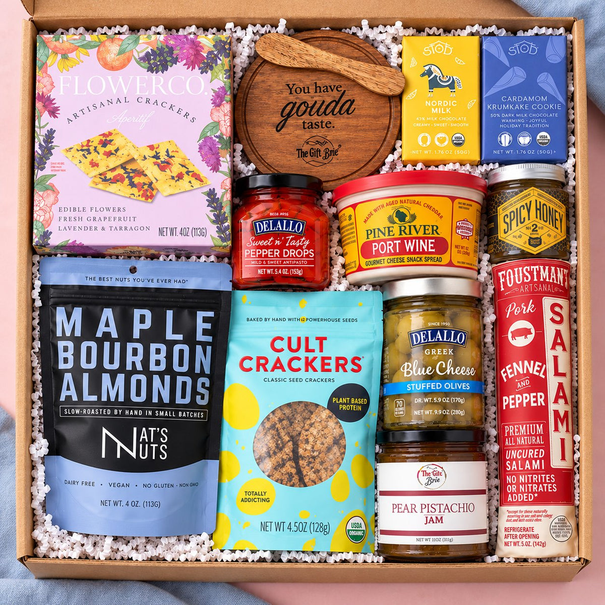 The Whole Shebang meat and cheese gift box with salami, port wine cheese spread, crackers, almonds, olives, jam, spicy honey and chocolate