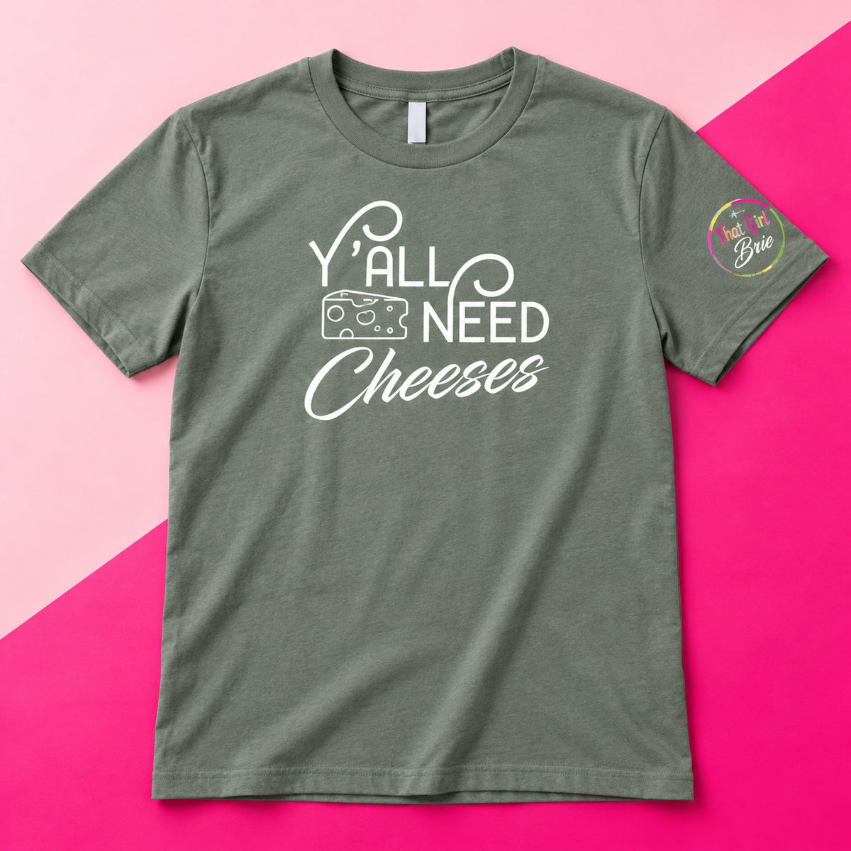 Y'all Need Cheeses t-shirt in heather green with That Girl Brie sleeve logo